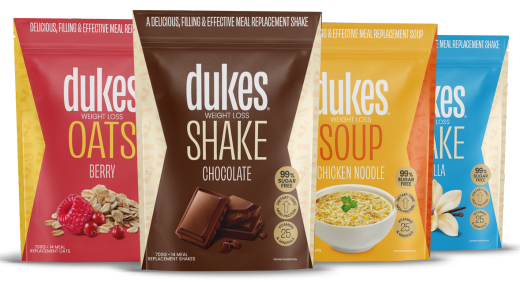 4 bags of Dukes Weight Loss Shakes standing up side by side, including berry, chocolate, chicken and vanilla flavours. 