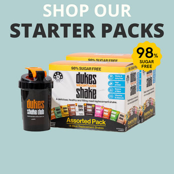 A image of a plastic protein shaker next to 2 assorted Dukes Weight Loss boxes with 