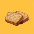 2 pieces of banana bread lying on top of one another with a yellow background